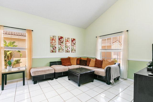 living room featuring light tile patterned flooring and high vaulted ceiling