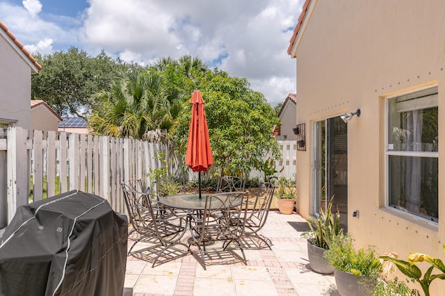 view of patio with a grill