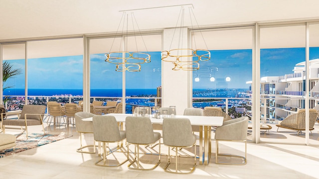 dining area with an inviting chandelier, a wall of windows, and a water view