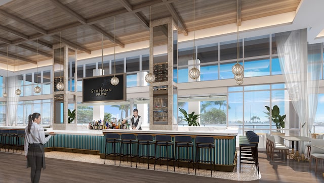 bar featuring a high ceiling, beam ceiling, wood-type flooring, wooden ceiling, and coffered ceiling