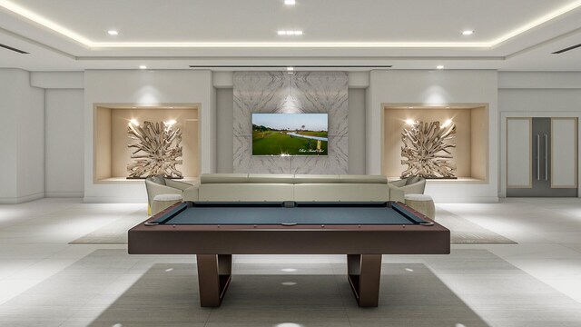 recreation room with light tile patterned floors, a raised ceiling, and billiards