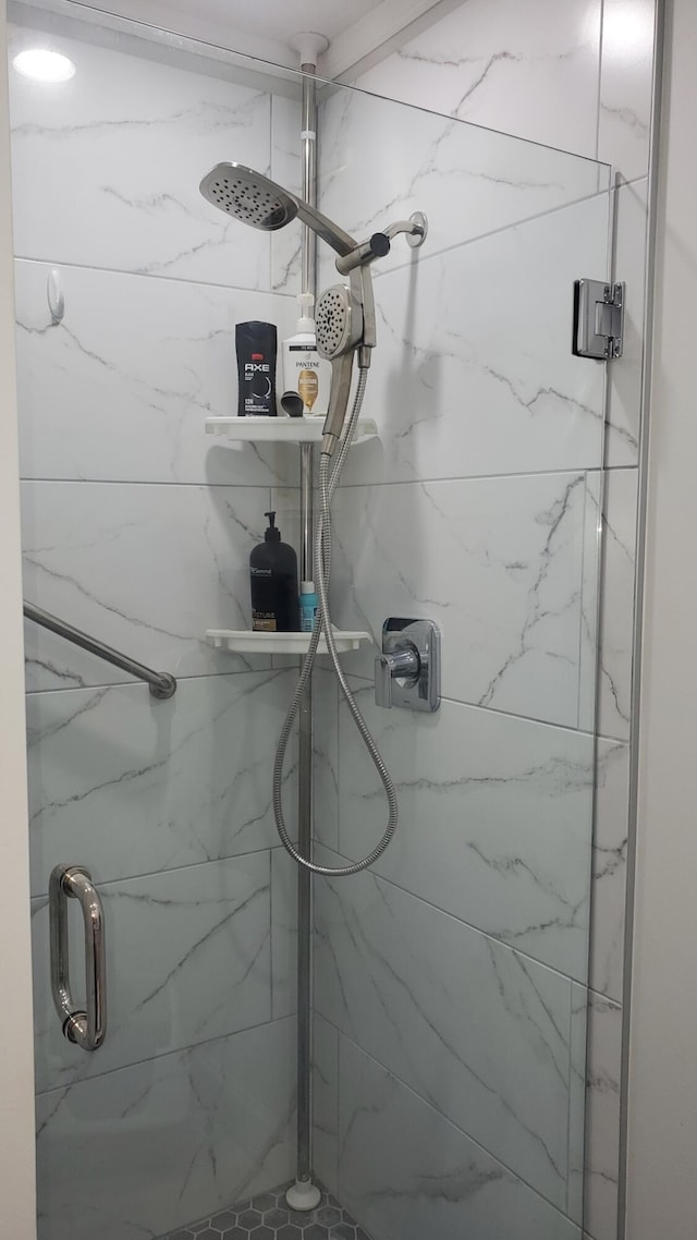 bathroom with a shower with shower door