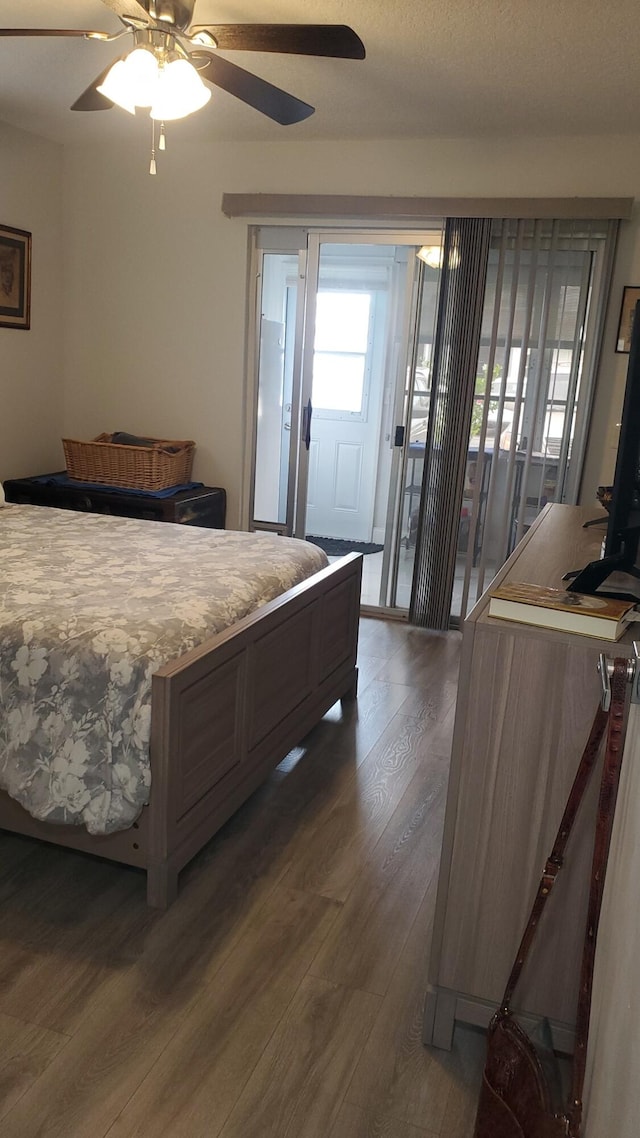 bedroom featuring ceiling fan, access to exterior, and wood-type flooring