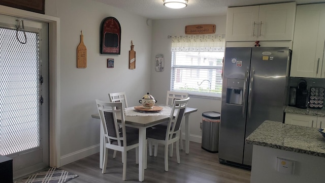 dining area with hardwood / wood-style flooring