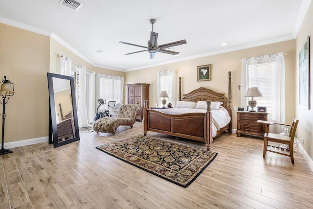 bedroom featuring light wood-type flooring, crown molding, ceiling fan, and a textured ceiling