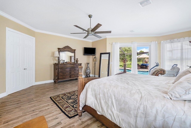 bedroom featuring crown molding, light hardwood / wood-style flooring, access to exterior, ceiling fan, and a closet