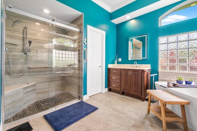 bathroom featuring crown molding, vanity, and independent shower and bath