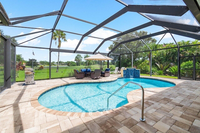 view of swimming pool featuring glass enclosure, a patio, and pool water feature