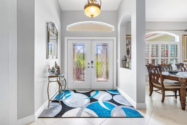 entryway featuring french doors and a wealth of natural light