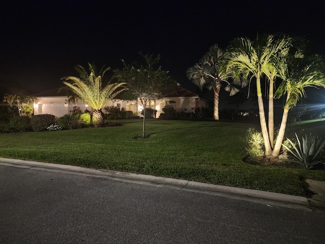 view of yard at twilight