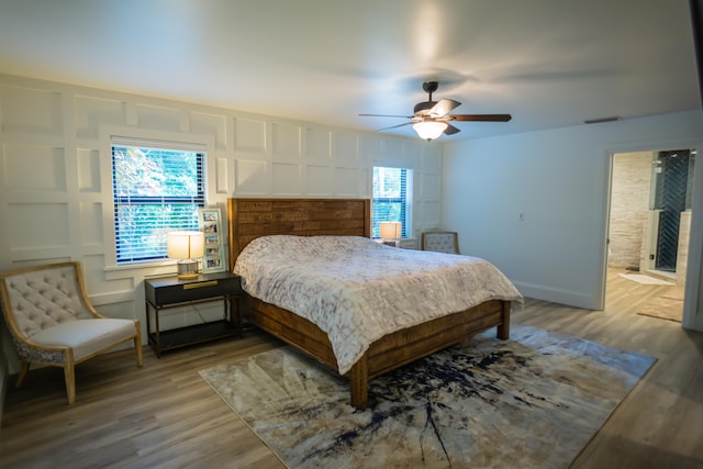 bedroom with hardwood / wood-style floors and ceiling fan