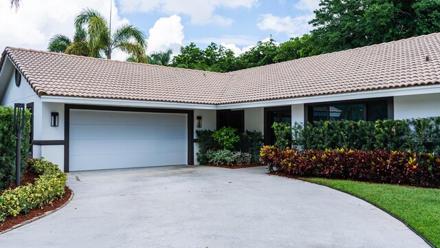 single story home featuring a garage