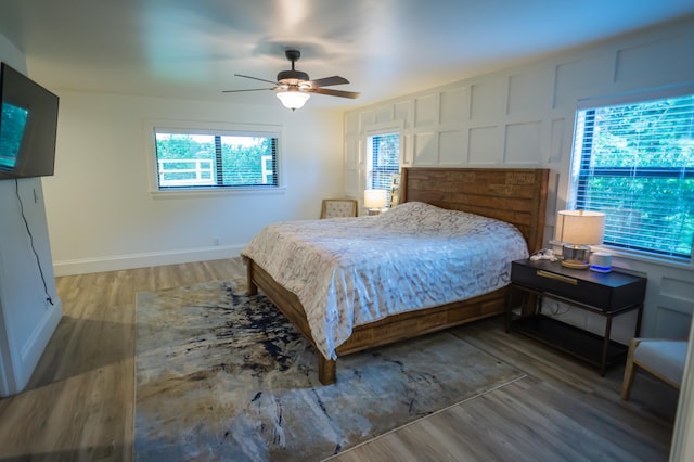 bedroom featuring wood-type flooring and ceiling fan