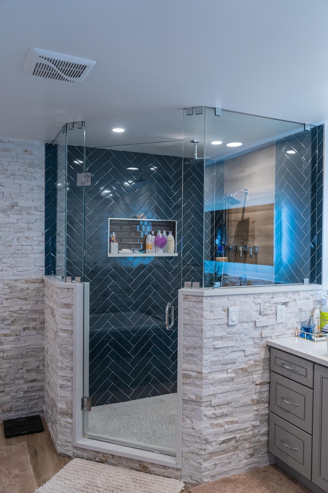 bathroom featuring vanity and walk in shower