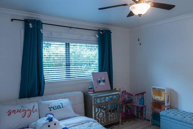 bedroom featuring ornamental molding and ceiling fan