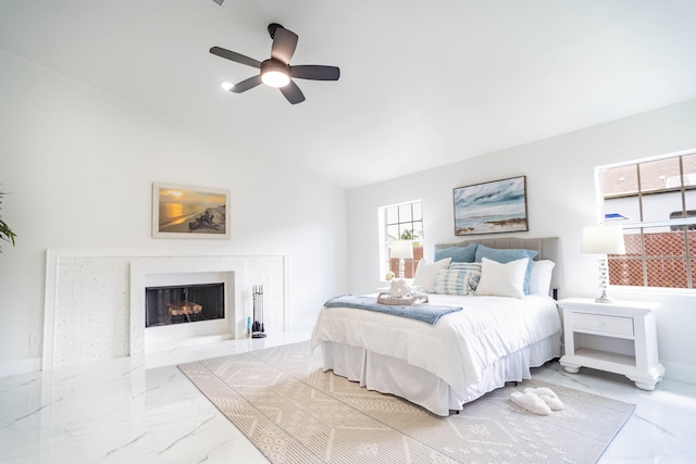 bedroom featuring ceiling fan and vaulted ceiling