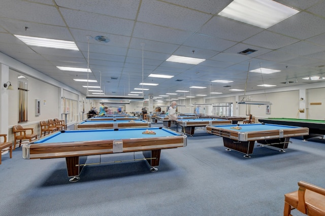 recreation room with billiards, a drop ceiling, and carpet floors