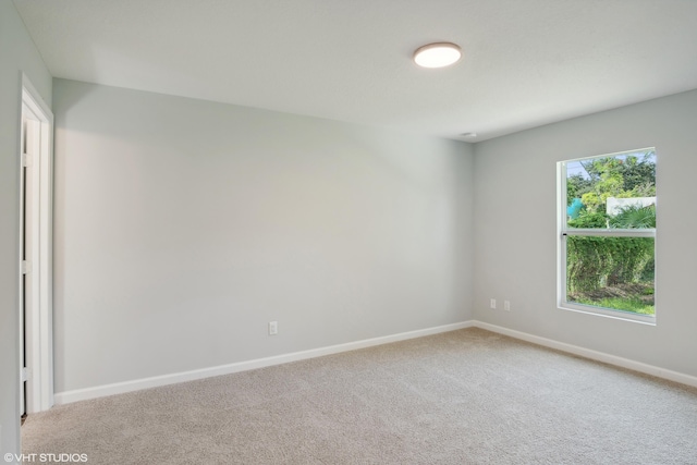 unfurnished room with plenty of natural light and carpet floors