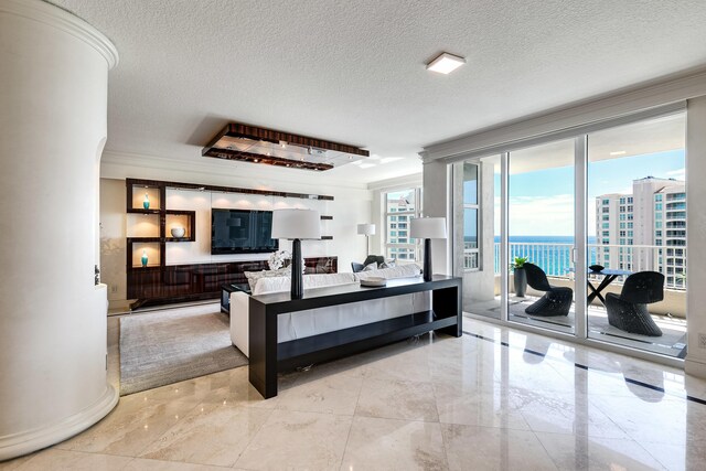 living room with a textured ceiling, crown molding, and light tile patterned floors