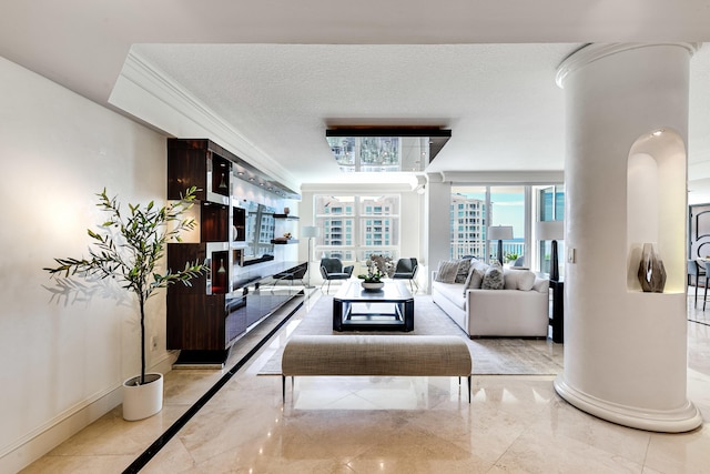 living area featuring a textured ceiling, marble finish floor, crown molding, and baseboards