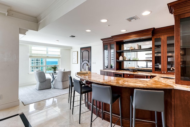 bar with light tile patterned floors, sink, ornamental molding, and light stone counters