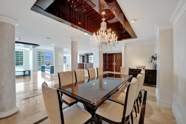 tiled dining area with a chandelier and decorative columns