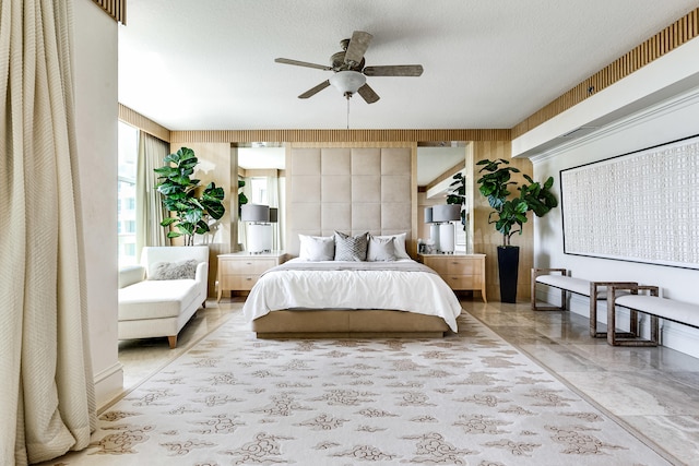 bedroom with ceiling fan and light tile patterned flooring