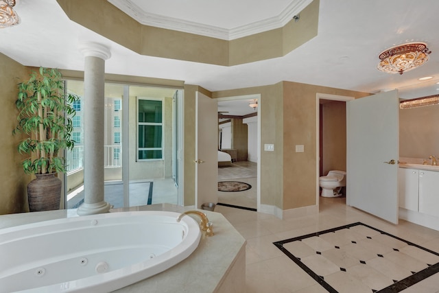 ensuite bathroom featuring decorative columns, toilet, ornamental molding, baseboards, and a tub with jets