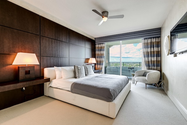 bedroom featuring carpet floors, ceiling fan, and access to outside