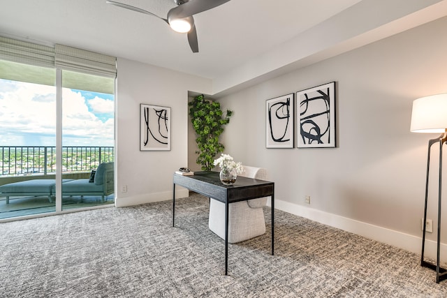 office space with ceiling fan and carpet flooring