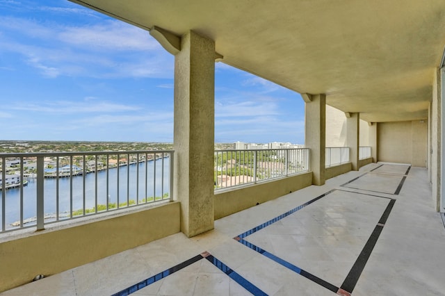 balcony featuring a water view