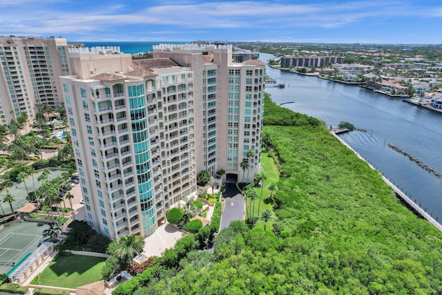 birds eye view of property featuring a view of city and a water view