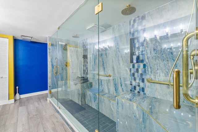 bathroom with walk in shower and hardwood / wood-style flooring