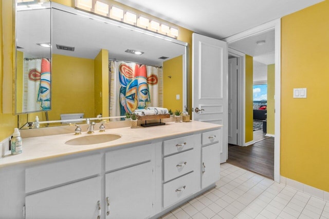 bathroom featuring vanity and tile patterned flooring