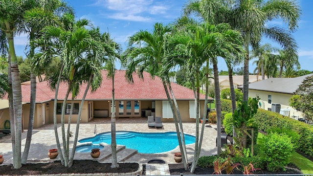 view of swimming pool with a patio area