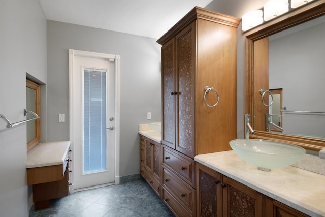 bathroom with tile patterned flooring and vanity