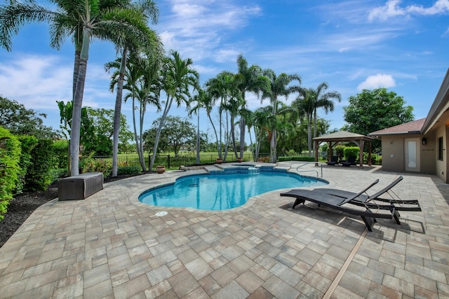 view of swimming pool featuring a gazebo and a patio area