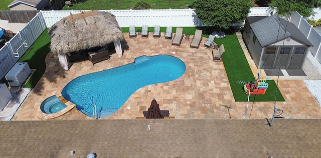 view of pool featuring a gazebo, an in ground hot tub, and a patio area