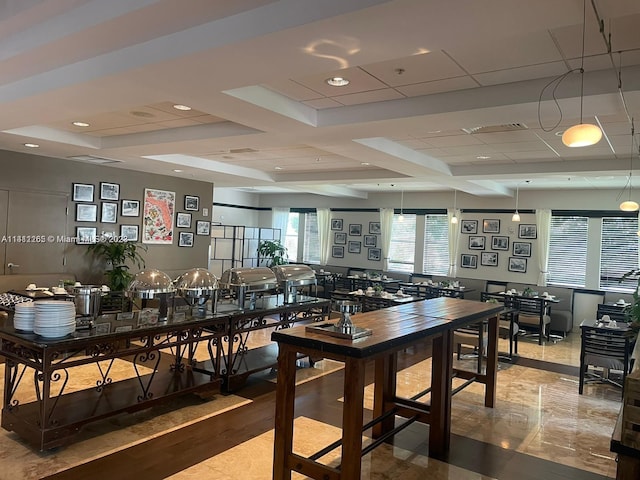 dining space featuring coffered ceiling