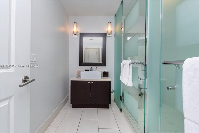 bathroom with vanity and tile patterned flooring