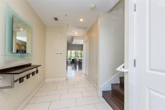 hall with light tile patterned flooring