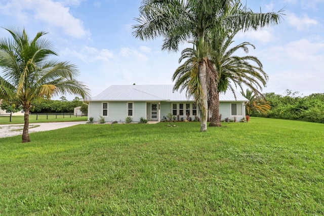 ranch-style home featuring a front yard