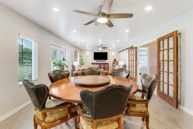 dining area featuring light hardwood / wood-style flooring, ceiling fan, and french doors