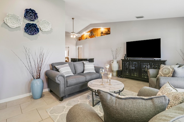 tiled living room with ceiling fan and lofted ceiling