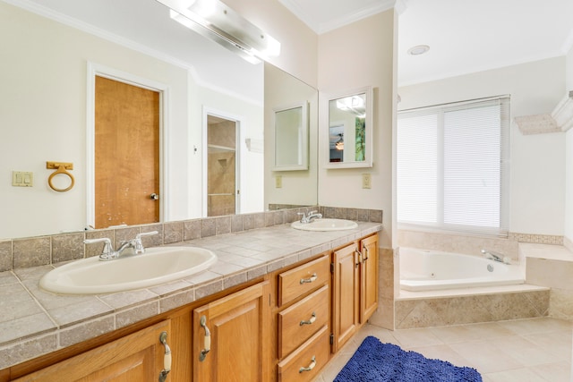 bathroom with dual vanity, crown molding, tiled tub, and tile patterned floors