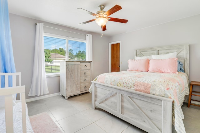 tiled bedroom with ceiling fan