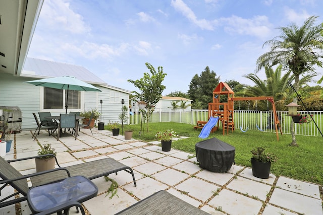 view of patio featuring a playground