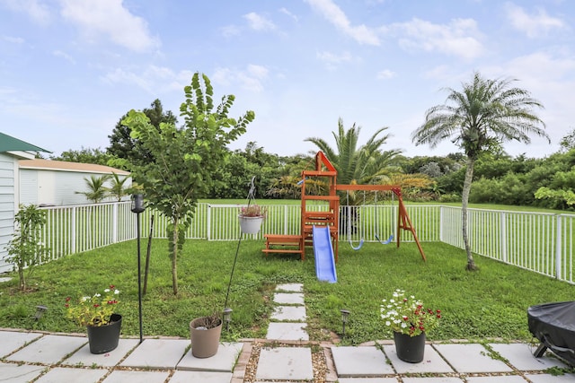 view of yard with a playground and a patio area