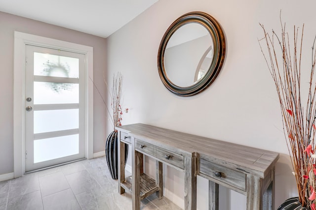 entrance foyer with light tile patterned floors