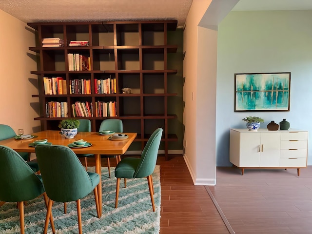 4908 Eaglewood Rd Unit A, Boynton Beach, FL 33436 - sitting room with baseboards and wood finished floors